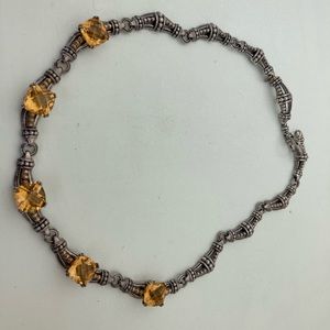 Lagos cetrine necklace with gold accents.